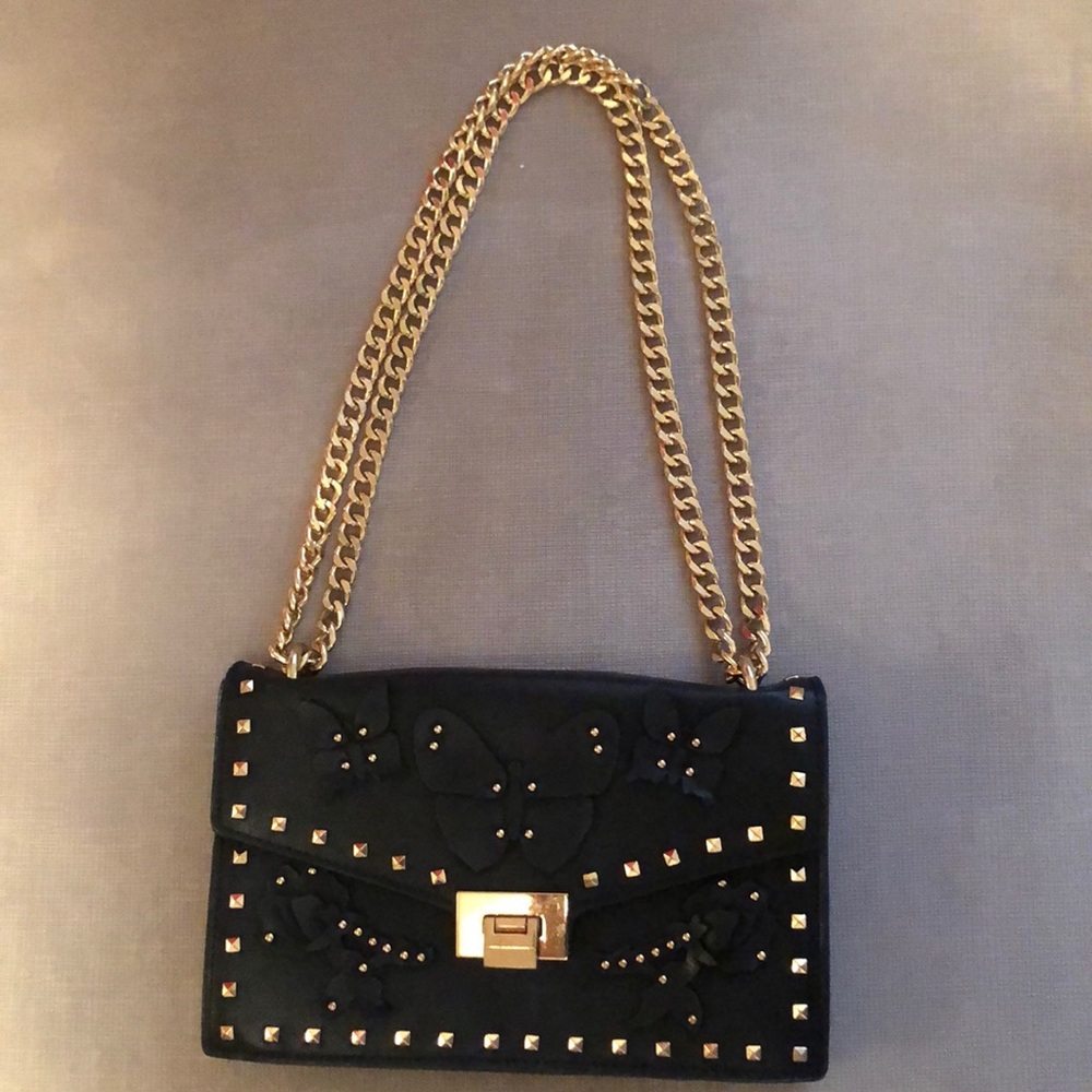Black purse with gold chain